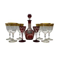 Late 19th/ early 20th century Bohemian ruby flash glass and engraved decanter with landscape and stag decoration, pair of matching liqueur glasses, a silver Sherry label and a set of six glass goblets with gilt and floral painted rims 