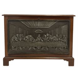 Mahogany storage box, the lifting lid over base with campaign handles and a depiction of The Last Supper, raised on bracket supports 