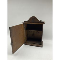Art Nouveau oak wall cabinet, the hinged door and pediment applied with stylized copper flowers, H43cm x W29.5cm