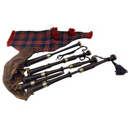 Set of early 20th century turned wood and ivory bagpipes the turned drones, possibly cocuswood, with nickel-silver collars and turned ivory mounts. Ebony chanter with impressed makers mark R.G. Lowrie Glasgow, leather bag with tartan cover and tasselled cord. This item has been registered for sale under Section 10 of the APHA Ivory Act