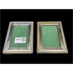 Pair of silver photograph frames with leaf border and easel stand aperture size 9cm x 6cm Sheffield 1995 Maker Carrs of Sheffield