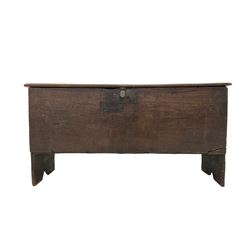 18th century oak six plank chest or coffer, the rectangular hinged lid with moulded edge, raised on V-shaped end supports