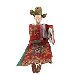 Two early to mid 20th century Chinese Opera dolls, each with painted composition heads and embroidered robes, together with another Chinese doll and hat 