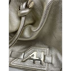 Three Anya Hindmarch handbags, two in black and the other in gold (3)