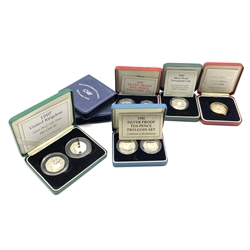 Seven United Kingdom silver proof coins/sets including two 1986 two pound coins, 1990 five pence two-coin set, 1992 ten pence two-coin set, 1997 fifty pence two-coin set etc, all cased with certificates