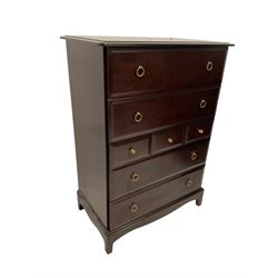 Stag Minstrel - mahogany chest of drawers, fitted with four long and three short drawers, raised on bracket supports 