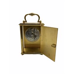A 20th century Swiss carriage clock with a 15 jewel Imhof movement, lever escapement, integral winding key, wound and set from the rear, silver effect dial with roman numerals, five-minute Arabic’s and a subsidiary second’s dial, with beveled glass panels to the front and sides.          