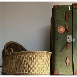 Early 20th century travel trunk covered in green fabric; and wicker moses basket