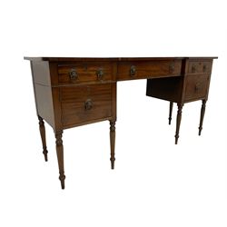 George III mahogany sideboard,  reverse break-front crossbanded top, central false drawer flanked by two drawers and two cupboards, on ring turned supports, fitted with lion mask and ring handles. Provenance: From the Estate of the late Dowager Lady St Oswald
