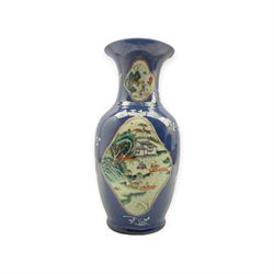 19th/ early 20th Chinese powder blue baluster form vase, the body painted with four shaped reserves in Famille Verte enamels with figures and landscapes, H44.5cm 