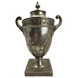 Edwardian silver urn shape cup and cover with twin handles, raised leaf decoration on pedestal and square foot H16cm London 1906 Maker C S Harris & Sons Ltd
