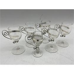 George III silver circular salt with blue glass liner, a similar smaller salt London 1919, silver pepperette and six liqueur glasses with silver holders