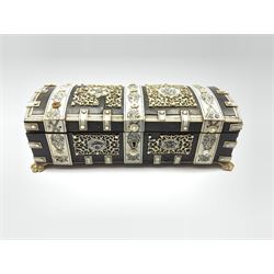 19th century Anglo-Indian Vizagapatam horn and ivory penwork work box, Vizagapatam, domed casket form, the exterior decorated with pierced foliate scrollwork panels within ivory penwork strapping on four paw feet, L23.5cm 