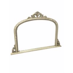 Traditional overmantle mirror, with arched top surmounted by scrolled acanthus leaf pediment, the distressed ivory painted frame enclosing mirror plate 128cm x 92cm