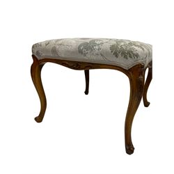 French style walnut stool, upholstered with foliate design fabric over base and legs with floral carvings