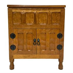 Yorkshire Oak - adzed oak side cabinet, the hinged top enclosing storage, all-over panelling and enclosed by two doors, on octagonal feet