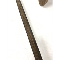 20th century Australian Aboriginal parrying shield of elongated oval form carved with geometric fluting and single integral grip, together with a tribal bow, L161