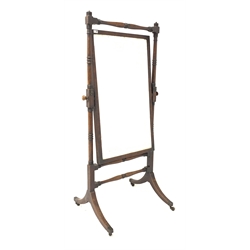  Mahogany Cheval mirror circa 1820, with ring turned supports and stretchers raised on splayed base with brass cup castors, 83cm x 175cm  