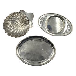 Victorian oval silver teapot stand with raised border and spade shape supports L16cm Chester 1899 Maker George Nathan and Ridley Hayes, oval silver card tray with pierced ends Birmingham 1923 and a silver shell shape butter dish London 1905 8oz (3)
