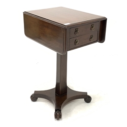 Regency mahogany drop leaf work table, with two drawers opposite two faux drawers, raised on a square pedestal leading to platform base and carved feet 