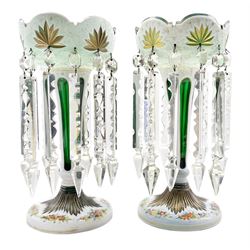 Pair of 19th century white overlay green glass table lustres, traditional coronet form with fluted fan cut decoration raised on a fluted cut base with painted floral sprays, hung with clear prismatic drops H33.5cm 
