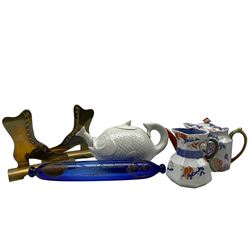 19th century Bristol Blue glass rolling pin inscribed with the motto 'Success to Napoleon' L35cm, 19th century glazed teapot modelled as a fish eating another fish, Victorian Masons Ironstone teapot and hydra jug decorated with Dragon moulded handles and a pair of Victorian brass and copper hearth ornaments in the form of boots (6)