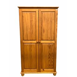 Polished pine double wardrobe, the interior fitted with shelf and hanging rail, (W100cm, H85cm, D53cm) together with a similar three drawer bedroom chest (W45cm, H60cm. D40cm) 