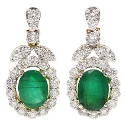 Pair of 18ct gold oval emerald and round brilliant cut diamond pendant stud earrings, total emerald weight approx 2.00 carat
