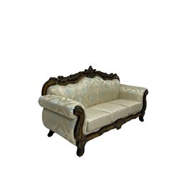 Italian Baroque design three seat sofa, hardwood framed, the cresting rail carved and pierced with c-scrolls and flower heads, scrolled arms, upholstered in floral patterned and striped fabric