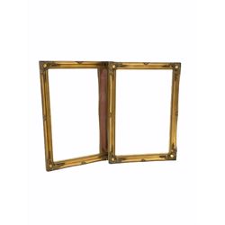 Pair of 20th century wall mirrors of classical design, the bevelled plate enclosed by floral moulded swept gilt frame 76cm x 107cm