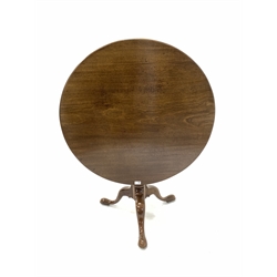Georgian mahogany tripod table, the circular single plank tilt top on spiral turned column, three out splayed supports and brass and leather casters