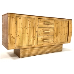 Angraves - Mid century oak and split bamboo sideboard, with glazed top over two cupboards and three drawers, raised on pedestal base, bearing ivorine plaque to reverse, Circa 1950s W155cm, H78cm, D49cm