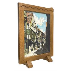 'Rabbitman' oak fire screen, with needlework panel depicting a street scene, carved with rabbit signature, by Peter Heap of Wetwang, W42cm, H60cm