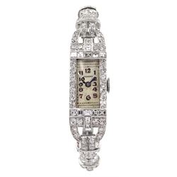 Vickery Art Deco platinum ladies diamond manual wind cocktail watch, the rectangular case with round and vari-cut diamonds and arched diamond lugs, stamped Platinum, on articulated platinum diamond and cordette strap with silver buckle