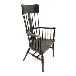 Early 20th century dark oak Windsor style armchair, with spindle back and floral carved splat and swept arms, saddle seat, raised on ring turned supports united by double 'H' stretcher, W71cm