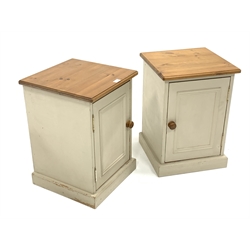 Pair of painted pine bedside cupboards, with panelled door enclosing single shelf, W40cm, H57cm, D40cm