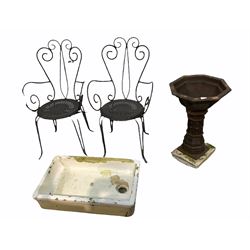 Cast metal birdbath of faceted octagonal form, (H70cm) together with a pair of scrolled wrought metal garden chairs (W56cm) and an enamelled stoneware sink (W77cm)