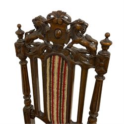 Pair of late Victorian Jacobean Revival heavily carved oak hall chairs, lion and cartouche cresting rail over fluted and slat back, striped upholstery, raised on turned fluted supports united by H-stretcher