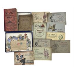 Ten cigarette card albums, stamp album and loose stamps