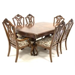 Late 20th century rectangular walnut double pedestal extending dining table, with three additional leaves, raised on four leaf carved splayed supports (281cm x 112cm, H78cm) together with a set of six (4+2) Chippendale style dining chairs with upholstered seats (W67cm)