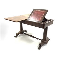 Mid 19th century rosewood library table, the revolving top moving to reveal stationery wells and sloped tooled leather reading/writing surface, raised on two octagonal turned supports united by turned stretcher, each on platform base terminating in scrolled feet and metal castors, W122cm, H77cm, D60cm