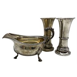 Silver sauce boat with C scroll handle Birmingham 1927 and a pair of silver waisted vases H14cm 
