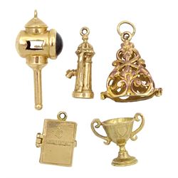 Five 9ct gold charms including lantern, driving licence, trophy and water pump, all hallmarked