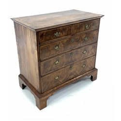 18th century walnut chest, cross banded top over two short and three long graduated drawers with herringbone inlay, raised on bracket supports 