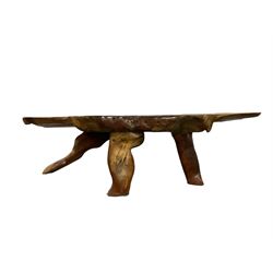 Naturalistic cherry wood coffee table, shaped rustic top on three supports