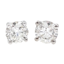Pair of 18ct white gold round brilliant cut diamond stud earrings, stamped 750, total diamond weight approx 1.00 carat