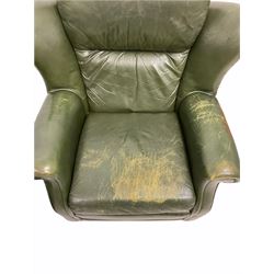Pair of vintage green leather wing back armchairs, with loose cushions, raised on castors, W94cm