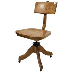 Globe Wernicke - Early 20th century oak office chair, the angle and height adjustable back rest over shaped seat, raised on a rise and fall four point swivel base with casters, 