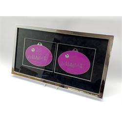 2012 Olympics, a pair of framed enamelled plaques 'Inspire a Generation', L60cm x 33cm overall