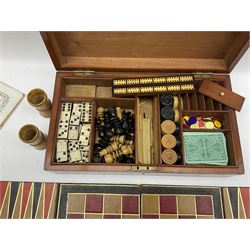 19th century mahogany games box, the divided interior with folding Backgammon and Steeplechase boards, Draughts and Chess pieces, Cribbage marker, Dominoes, treen dice cups, rule book etc 39cm x 22cm x  10cm